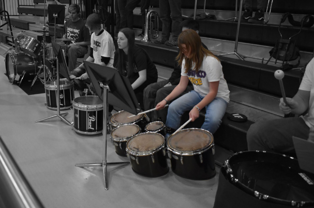 Schoenig playing tenor drums in the pep band at a home basketball game on Jan. 19. The tenor drums are one of Schonig’s favorite instruments to play (Photo by D. Heinen). 