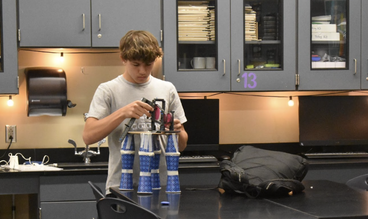 Parker Simon, 11, works on their Intro to Engineering project. Intro classes can help students find an interest in the subject matter and help them decide whether they want to pursue the topic in the future. (Photo by K. Simpson)