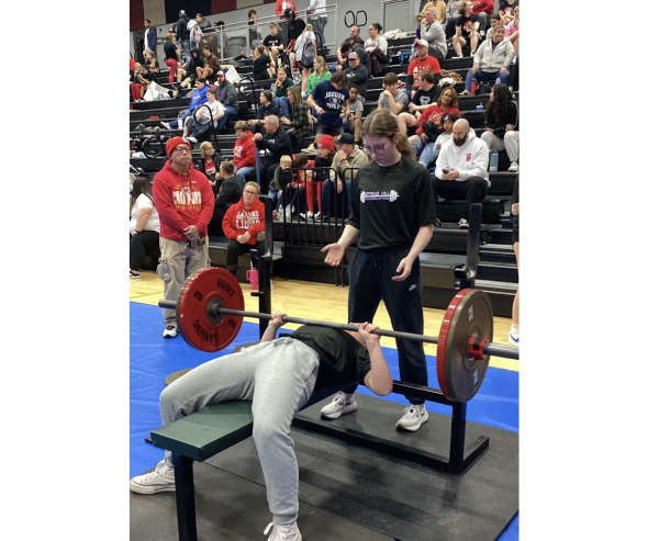Chase Shideler, 10, competing at the Lansing Invitational Meet, benching 115 pounds. Shideler was one of many Spring Hill lifters in the womens division as an underclassmen. (Photo by H. Booze)  