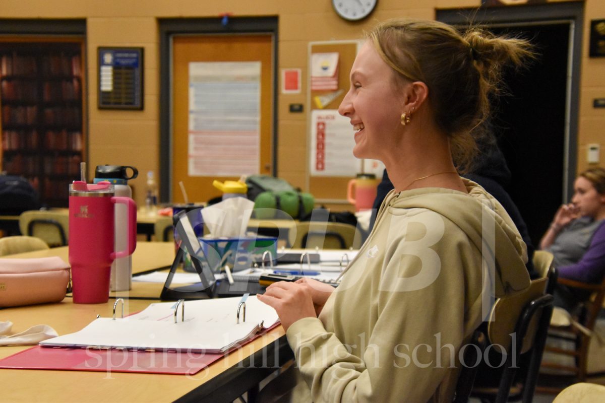 On March 5, Addelyn Horne 11, assistant stage manager, laughs during a practice run through of the spring play “Macbeth.” 