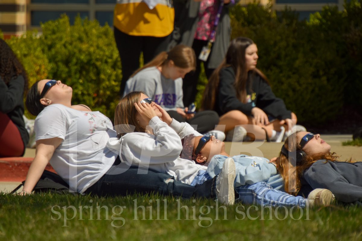 On April 8, Jordyn Vander Veur, Macey Chaulk, Langston Nichols, and Zoe Chronister, 10, gather outside to enjoy the solar eclipse. 