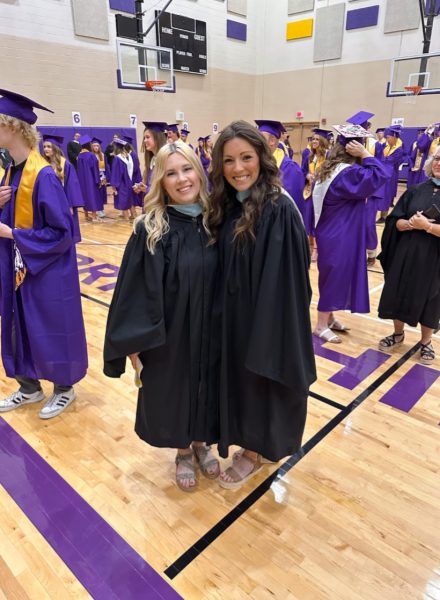 Delgado and Oshel take a picture in their matching gowns for senior graduation. Their close friendship started seven years ago (Photo provided by E. Delgado). 