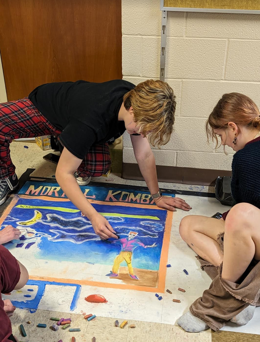 Deterring and Mikayla Duncan, 11, work on the chalk contest at Highland. They placed on second (Photo by A. Rushing). 