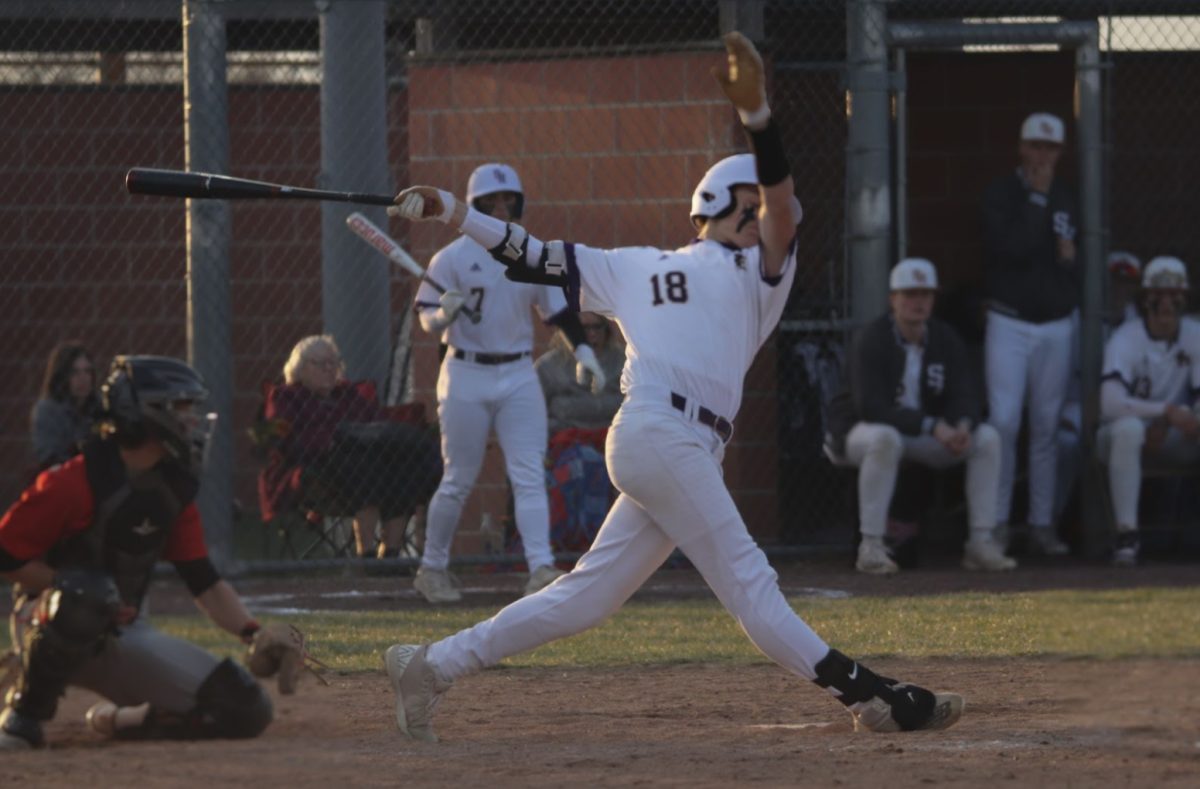 Sam+Harris%2C+9%2C+swings+and+misses+while+at+bat+against+a+Tongie+pitcher+on+Mar.+28.+%28Photo+By+M.+Brown%29