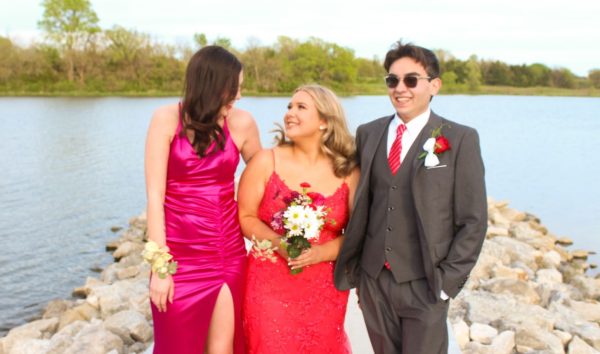Ashlyn Watson, 12, Faye Dent, 12, and Caleb Brewer, 12, posing for prom pictures. Brewer and Dent are one of the many friends that Watson has made throughout the year (Photo by C. Bartek). 