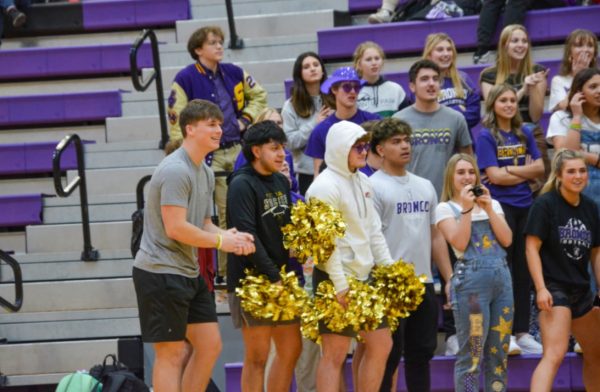 The Senior Class of 2024 cheers on the Boys Basketball Team during the balloon popping competition at the Winter Homecoming Pep Rally. This would be the last Homecoming Pep Rally seniors will attend (Photo by M. Pharathikoune).