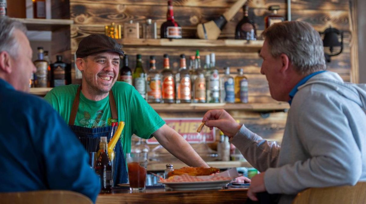 Shaun Brady, chef and co-owner of Brady & Fox, speaks to customers at the bar (Photo by E. Curiel).