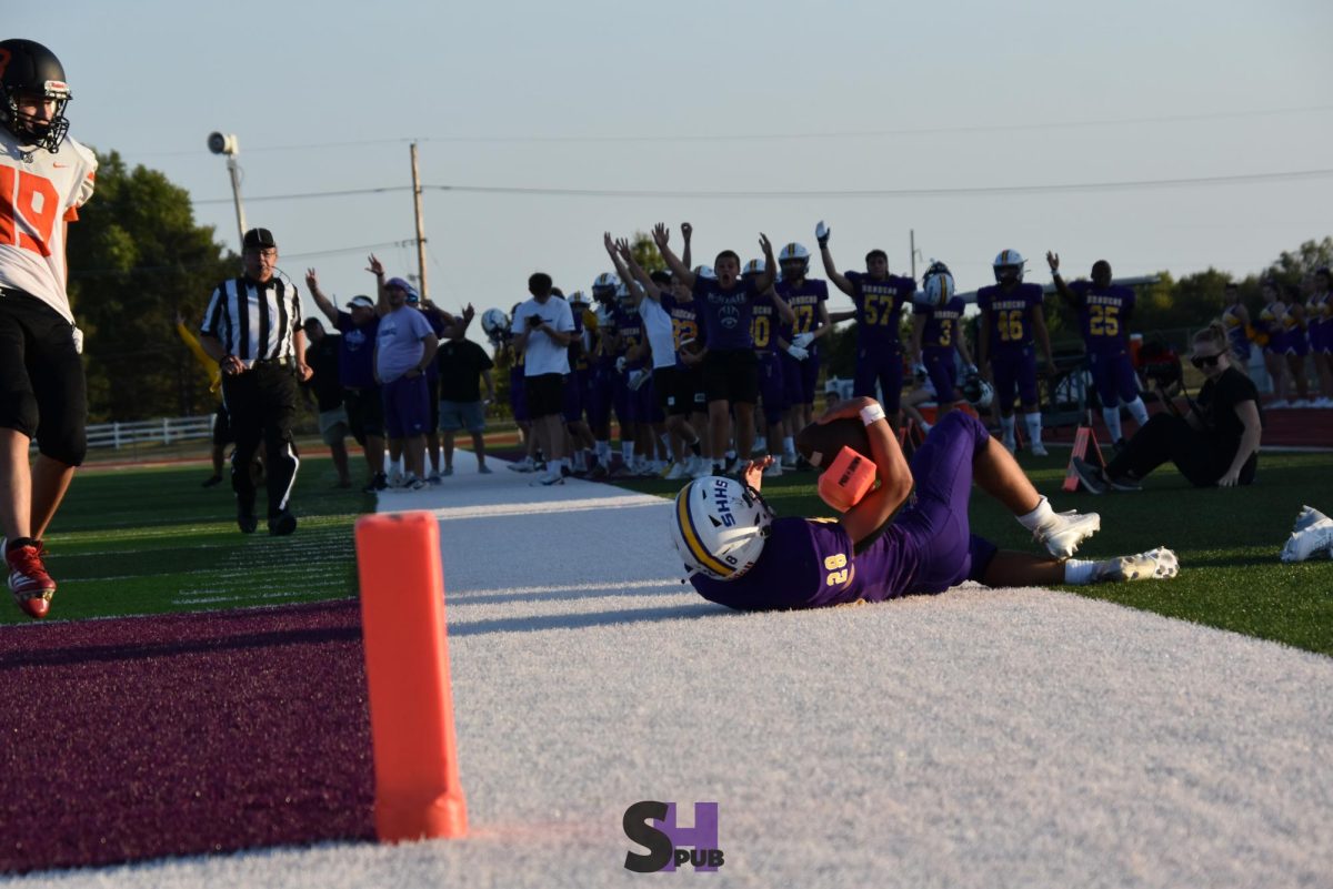 On Sept. 9, Maysen Dodson, 9, dives into the endzone for a touchdown during a JV football game.