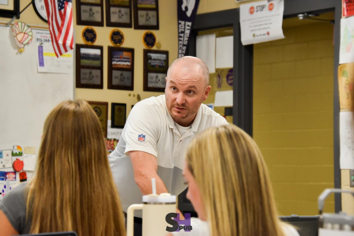 William Meier lectures at the front of their honors biology class Sept. 6.