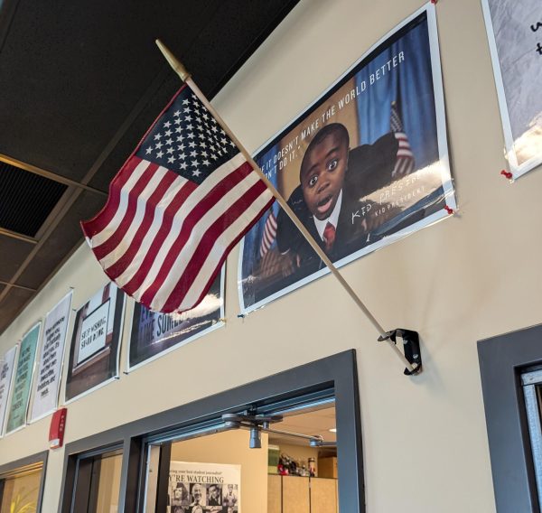 The U.S. flag hangs on the wall of Anna Manning, communication teacher's, room. This was where students say the pledge as apart of the morning announcements. (Photo by Ava Rushing).