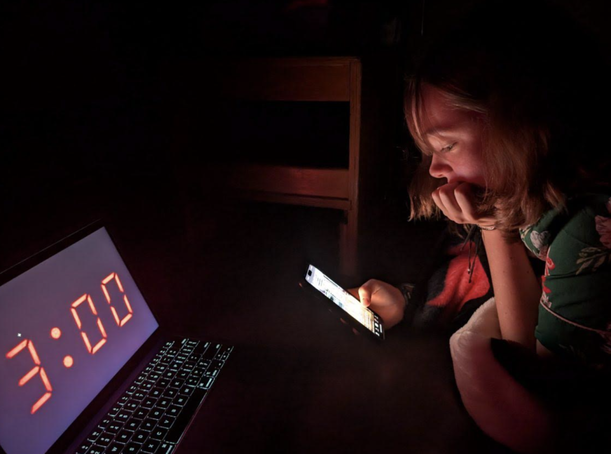 Hannah Mueller, 12, shows a common teenage addiction by scrolling late at night. This is an example of how normal addition is. (Photo Illustration by A. Rushing)