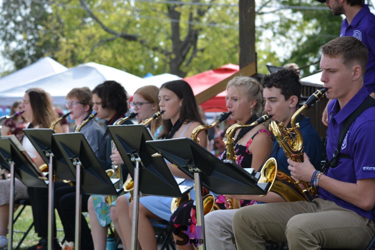 On Sept. 28,  saxophone players of the jazz band play for the community in the city park at the annual Fall Festival.