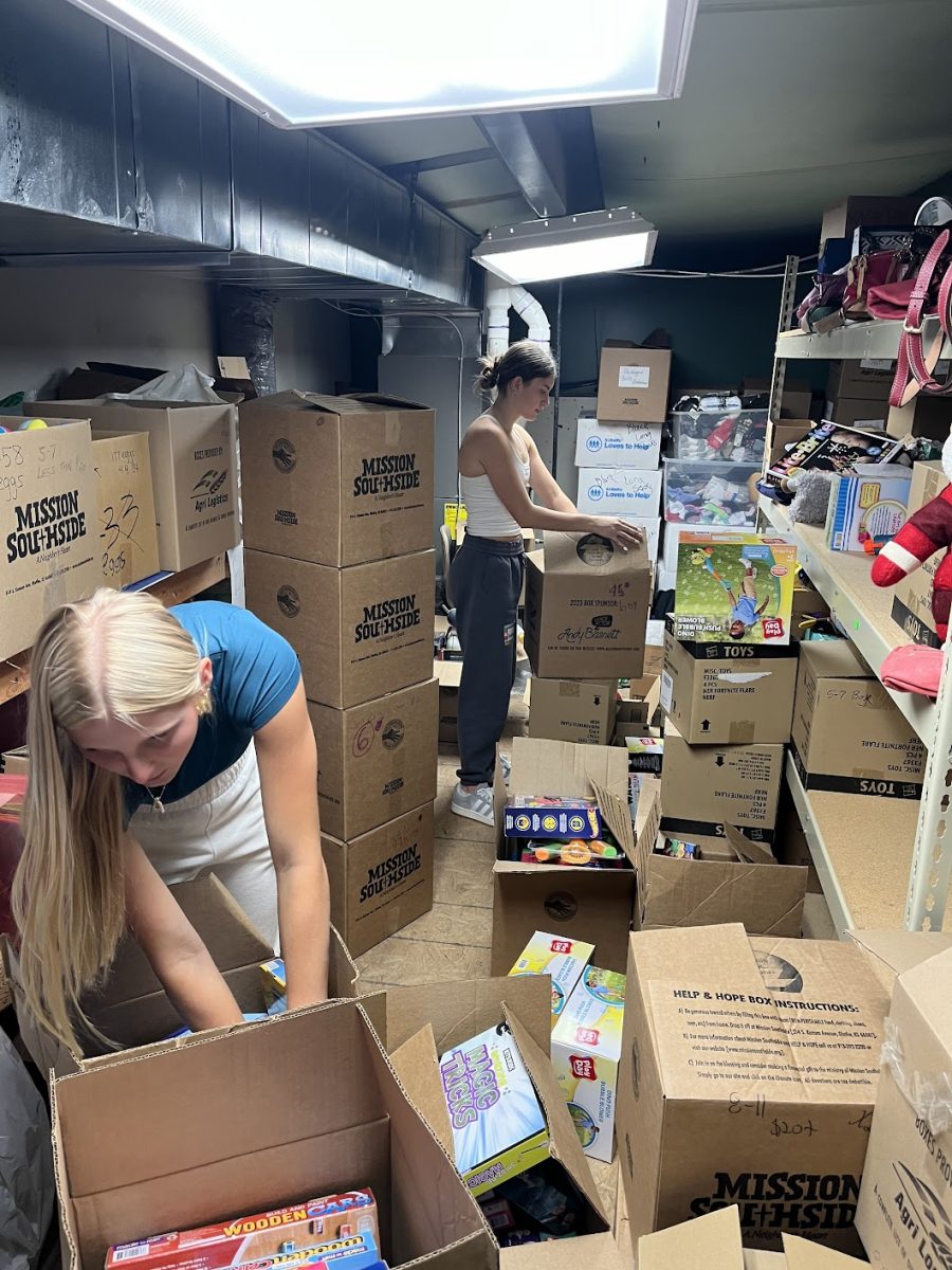 Alexandra Gulbrandson, 10, and Ainsley Aten, 10, are organizing donated Christmas toys at Mission Southside (Photo submitted by Kerri Rodden).