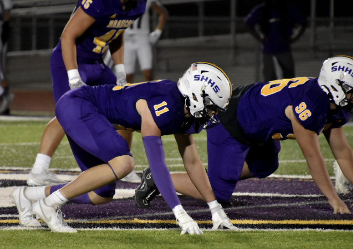 Cade Myers, 12, lines up on the defensive line against the opposing offense. The Broncos defeated Piper 20-13 on Sept. 27. (Photo By. S Hatcher)