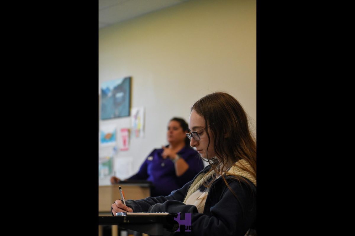 On Oct. 29, Allie Albright, 11, takes notes over synthetic division of polynomials in honors algebra II.