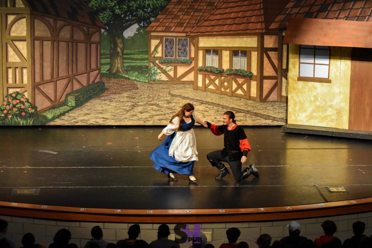 Belle, played by Maryanne McNally, 12, and Gaston, played by Zachary Vasser, 12, perform the duet “Me” in which Gaston tries to convince Belle to marry them Nov. 14.