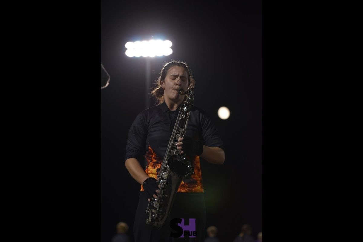 On Oct. 18, Addison Bond, 12, plays a solo during the second movement of the marching band’s show “Embers.”