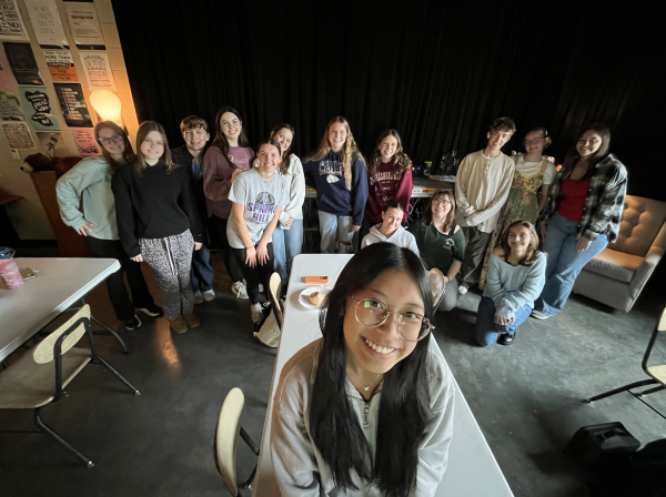 Kayley Tran, 11, sits with the SPUB staff during class. (Photo by A. Manning) 