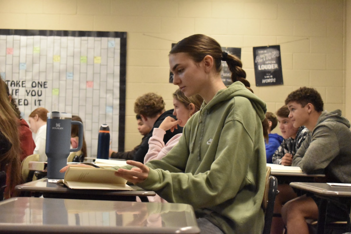 Adrianna Janovick, 9, reading during her fourth hour English class. They are on the Romeo and Juliet unit and are required to read a few chapters every week in order to be successful in the classroom. (Photo by M. Chaulk) 