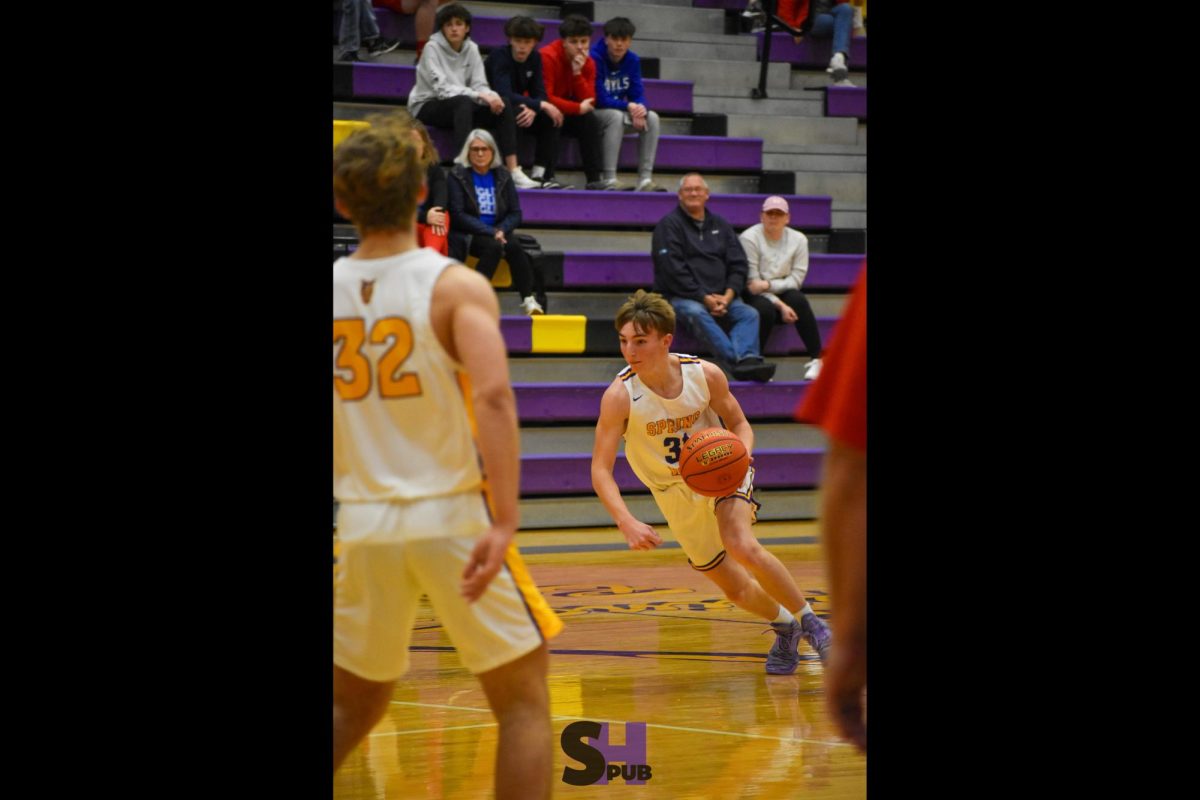 Shaun Best, 9, drives down the court in a basketball game against Wellsville Dec. 10.