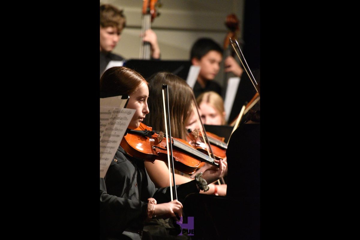 Zofia Spiewacki, 9, plays the violin at the orchestra’s winter concert Dec. 11.