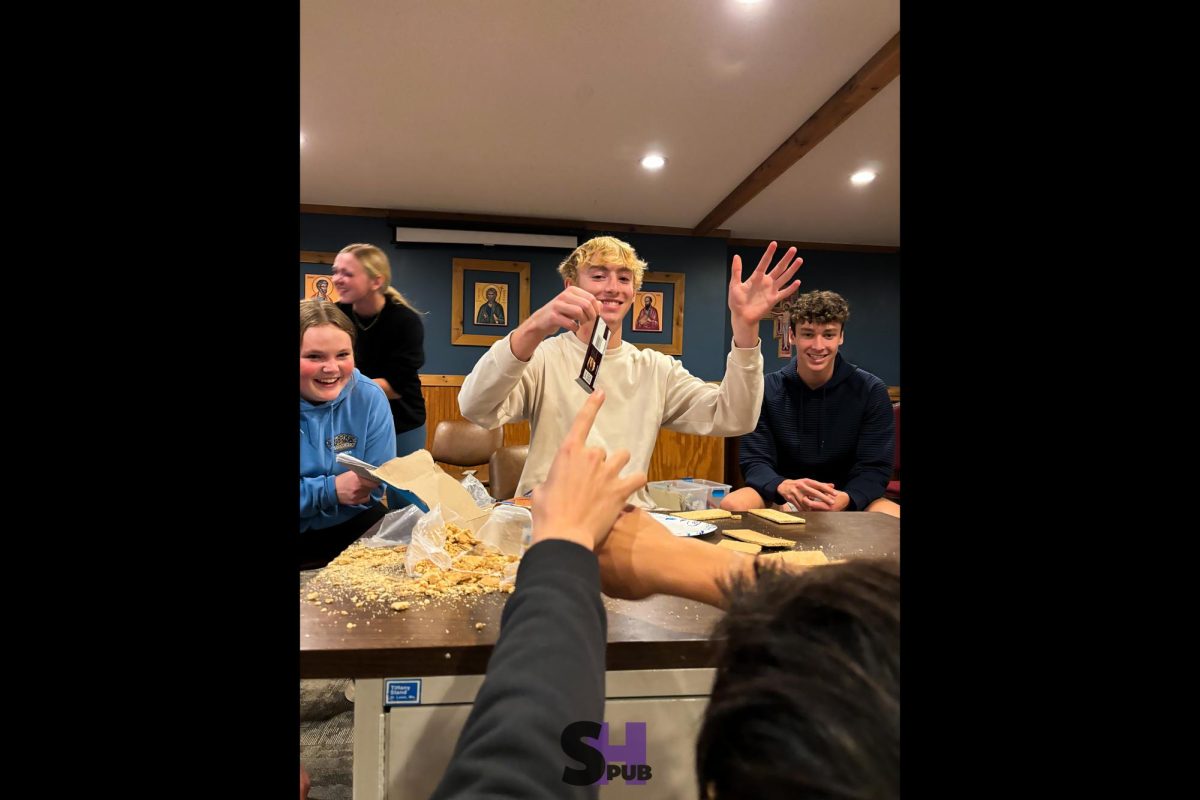 On Nov. 6, Miles Pankey, 12, leads a leadership activity involving the process of making a s'more that is meant to showcase the importance of clear communication during the annual PALs retreat. 