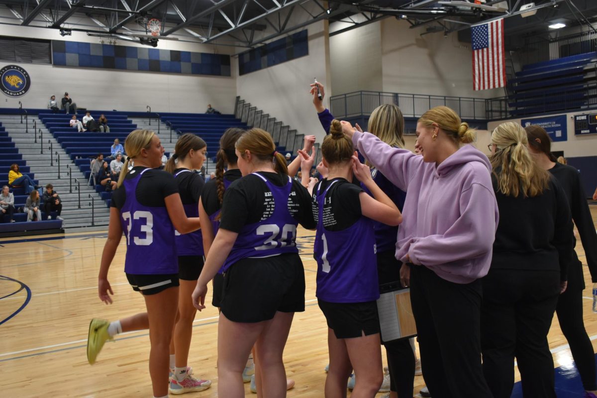 On Dec. 3, the girls varsity team plays against Mill Valley High School. The girls huddled up to discuss their game plan. (Photo by A. Nichols)