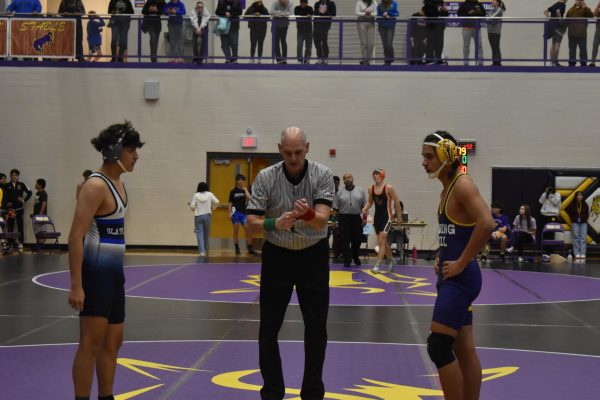 Teyshawn Iosia, 11, preparing for his next match to commence against his opponent from Olathe West. Once the referee blows his whistle, the match will begin. (Photo by B. Proterra)