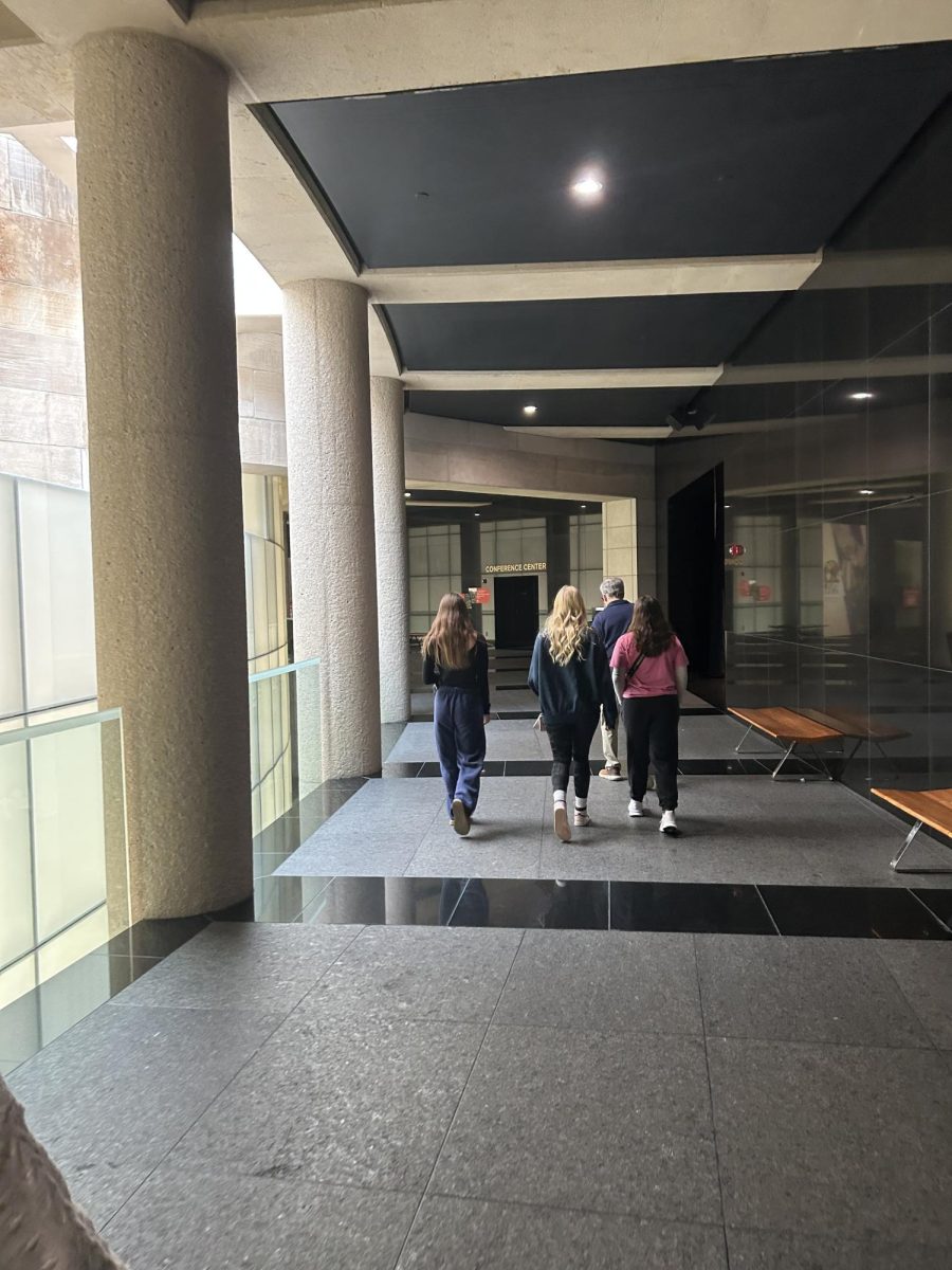 Students walk behind a tour guide inside the National World War I Museum. The tour guides helped inform students about the meaning behind the items and relics inside the museum. (Photo by Danny Heinen)