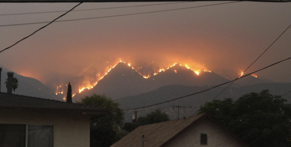 Fires tear through neighborhoods in Los Angeles, California. These fires are expected to continue in the coming days. (Photo by Eddiem360)