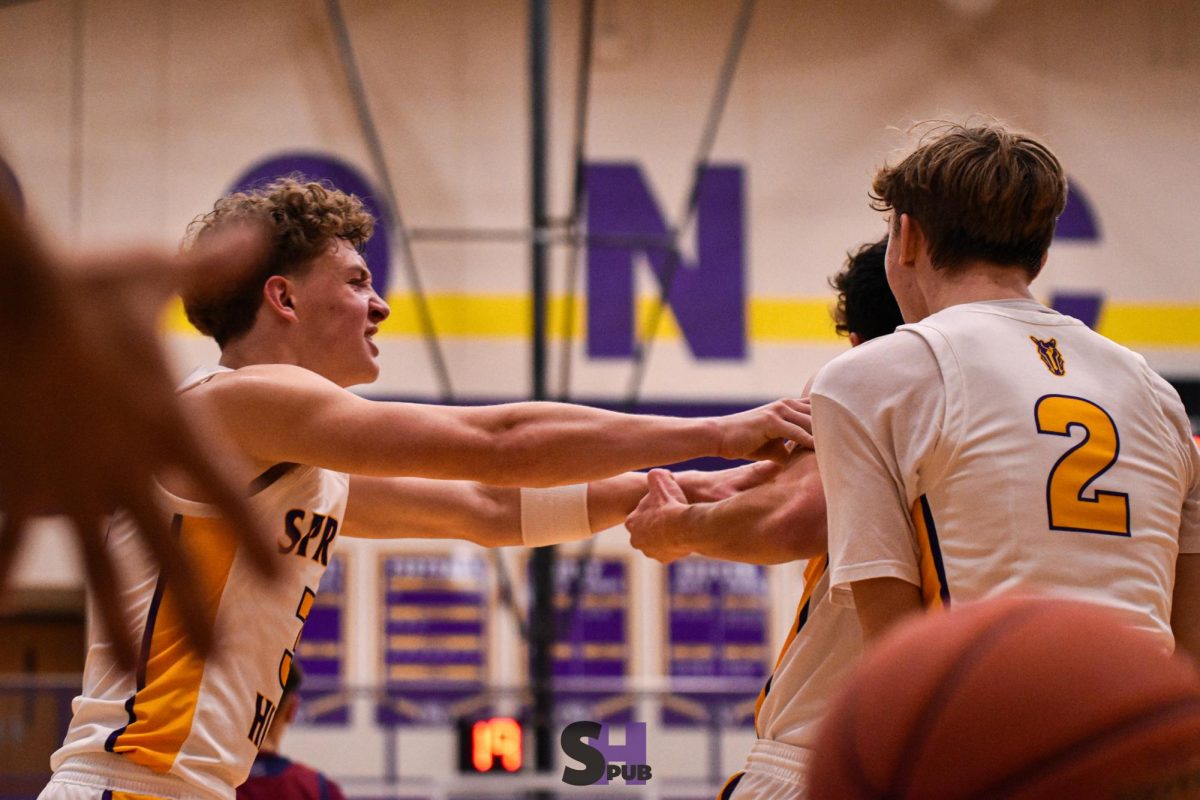 Jordan Miller, 11, celebrates with teammates after Jackson Bruce, 10, made a game-tying three-point shot to send the game into overtime Jan. 3.