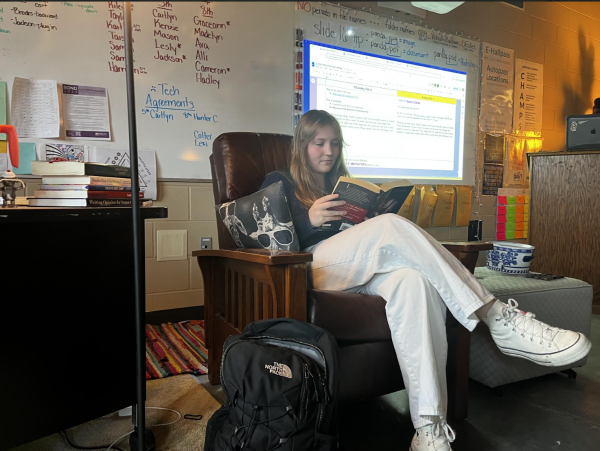 Mallory Marmon, 11, reads a book. Reading is a hobby that they enjoy. (Photo by A. Rushing) 