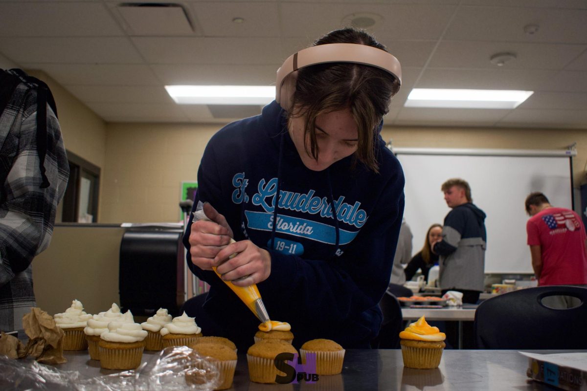 On Feb. 7, Amaliya Barker, 10, frosts cupcakes for a cupcake-baking competition.