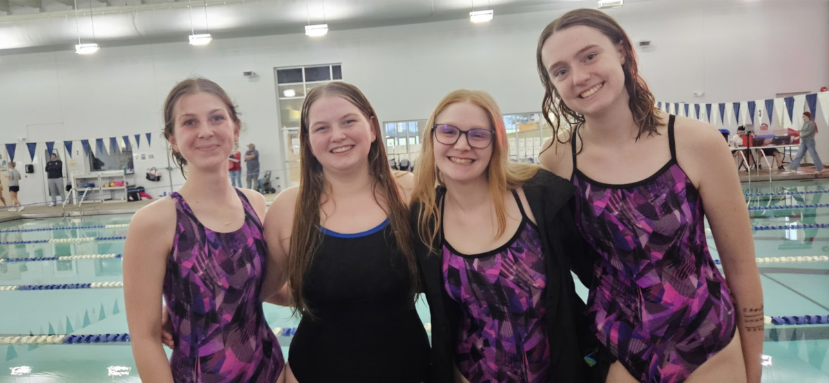 The four seniors pose together for a photo following their senior night recognition. (Photo provided by O. Tarvin)