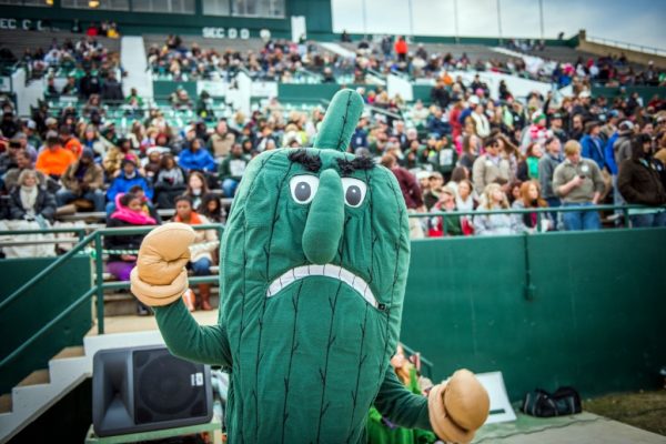 The Delta State University Fighting Okra cheers at a football game. Finding community through events like games can help foster a sense of hope in a grief-stricken community.