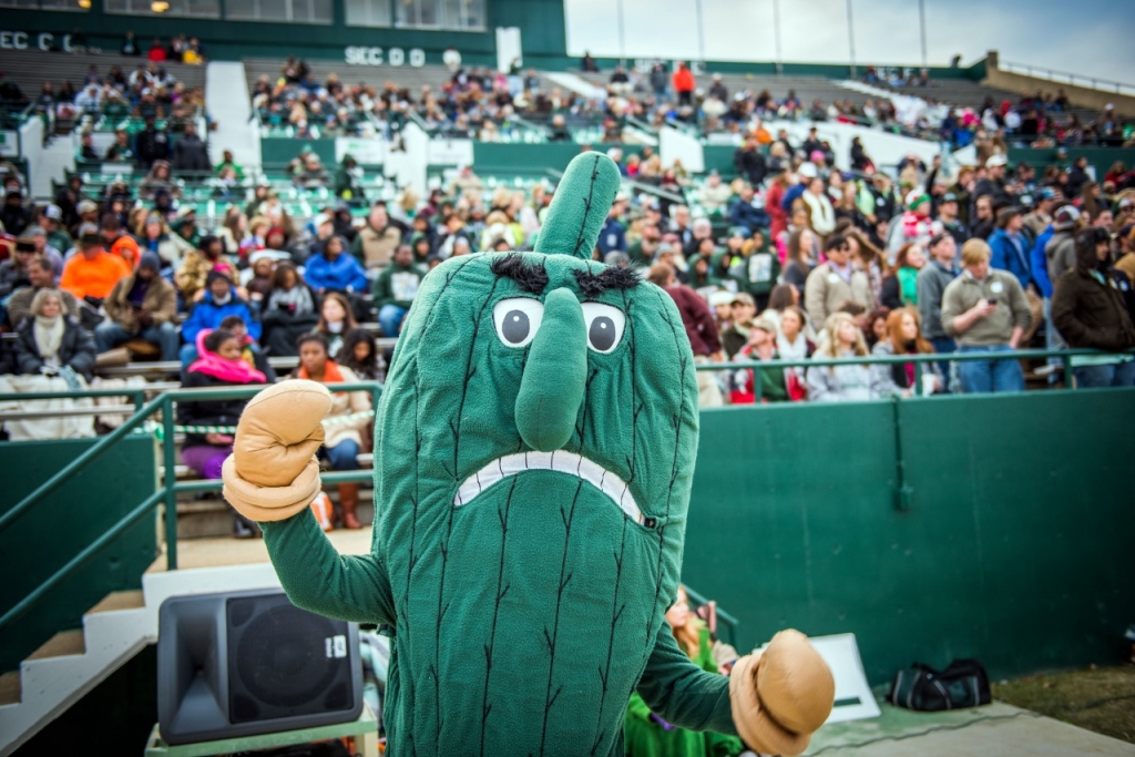 The Delta State University Fighting Okra cheers at a football game. Finding community through events like games can help foster a sense of hope in a grief-stricken community.