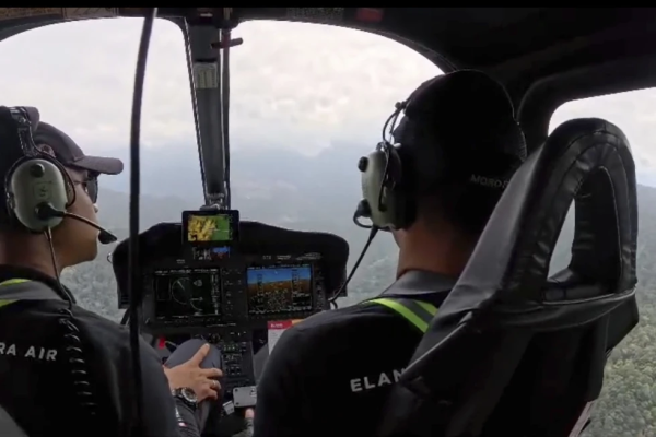 Search-and-rescue agents fly over the area in one of two helicopters used in the search.  The helicopter was found in the afternoon of Sept. 3, and since then one body has been discovered. 