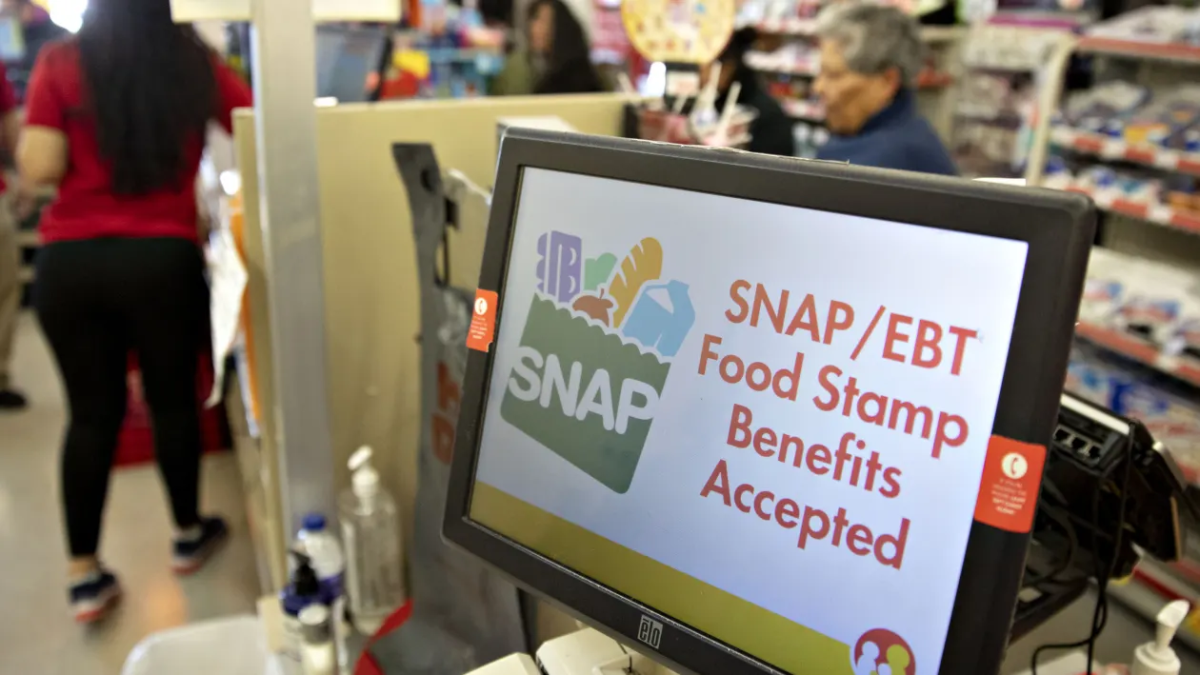 In a Family Dollar store in Chicago, a screen shows that food stamps are accepted. A large amount of Americans rely heavily on food stamps.