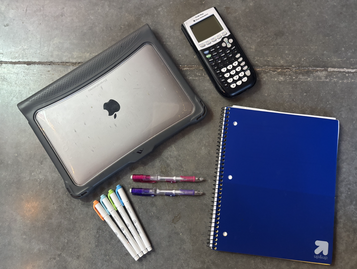 Various school supplies are displayed. Academic pressure is one challenge that students may face. 