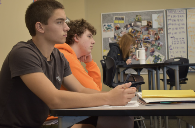 Jace Barberis, 10 and Trevor Joyce, 11, sit next to each other during their math class. Advice from junior classmates can be helpful regarding academic tips.