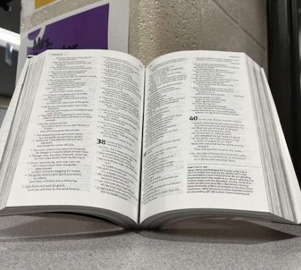 An open bible is displayed. An individual’s faith can be strengthen through church.
