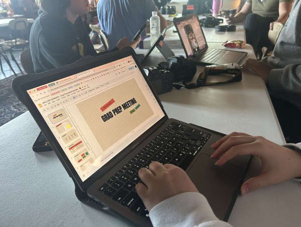 Mallory Marmon works on her presentation for her senior-led meeting.