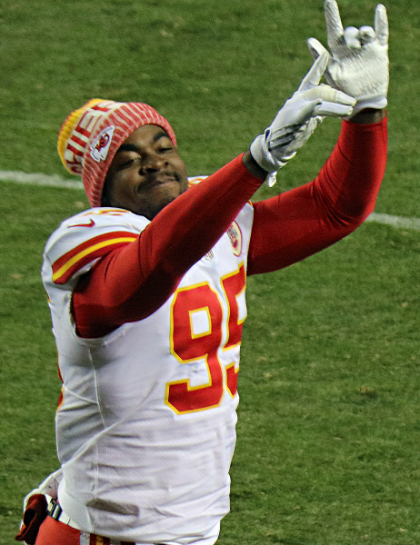Chris Jones hits a celebration pose at one of his football games. He is always showing off his enthusiasm for the game.