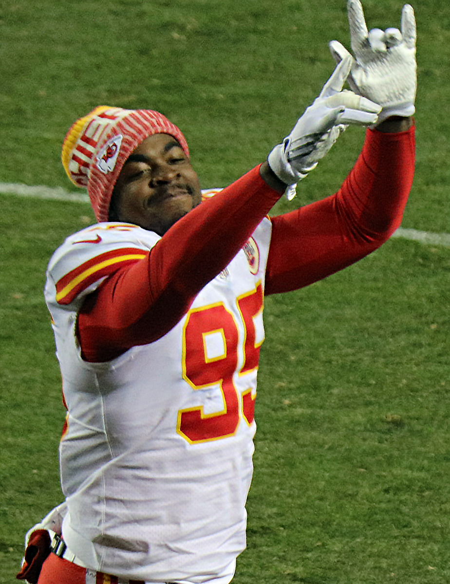 Chris Jones hits a celebration pose at one of his football games. He is always showing off his enthusiasm for the game.