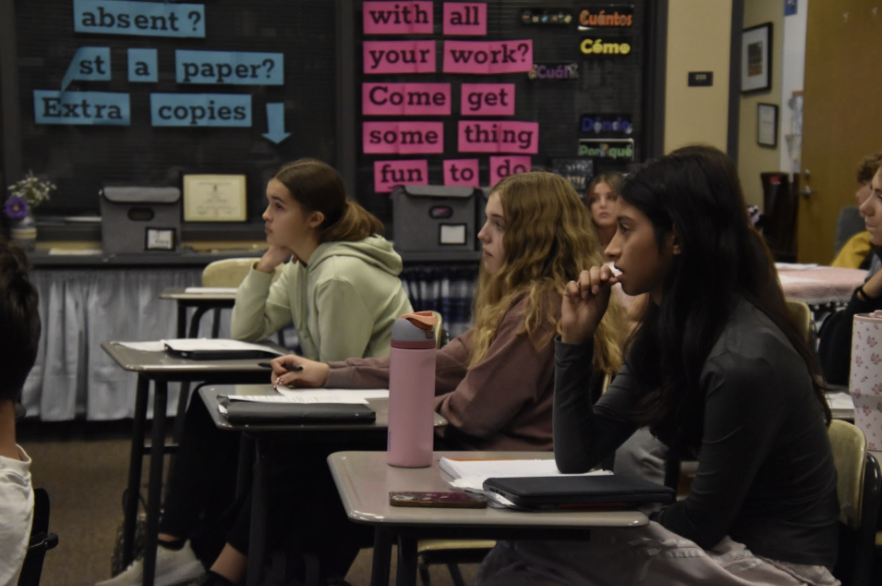 While going over an assignment in class, Sara Guarneros and Kensington Romo, 9, along with Brooklyn Azevito, 10, are making sure to actively listen. In Spanish I, all this information was new to them, meaning that understanding was crucial.