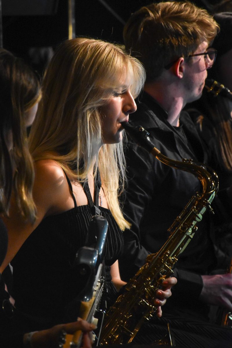 On Dec. 15, Lily Hunt, 12, plays the tenor saxophone during the winter concert.