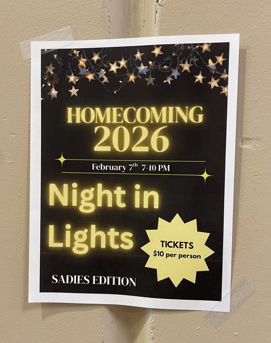 Homecoming posters are hung up around the school with information about the dance.
