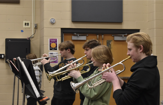 Eli Rasch, 11, Seth Hupe, 10, Arryson Erhart and Ethan Rasch, 9, rehearse together during jazz band, hitting every note in perfect harmony. The room fills with sound as the practice turns into progress.