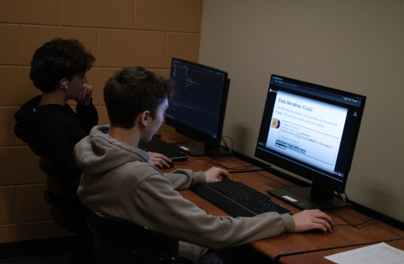 Students Dylan Seidler and Reis Martin, 11, turn their backs to the world and lose themselves in the online world. Outside of questionnaires, many people harness the internet for their sneaky stances.