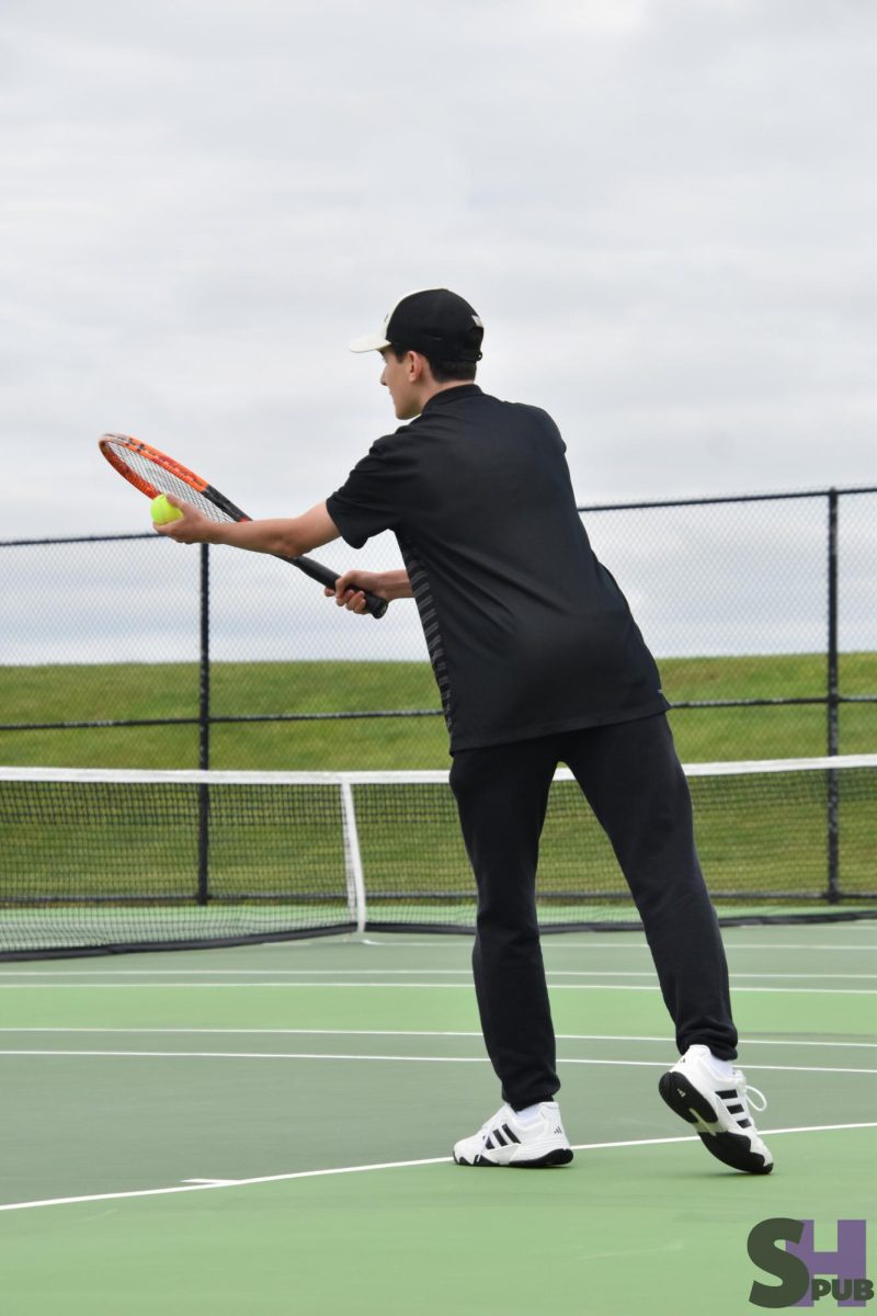 On April 28, Carson Loiseau, 10, gets ready to serve the ball at a home tournament.